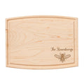 The Maple 12" x 9" Arched Maple Board features natural wood grain and an engraved honeybee illustration with “The Rosenbergs” in elegant script on the lower right corner. Personalization available.