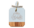 The Maple 16 x 10" Acacia Heirloom Board in Light Blue features a gilded pumpkin illustration, gold cheese spreader tied at the handle, and ribbon—ideal as a laser-engraved festive charcuterie or cheese board.