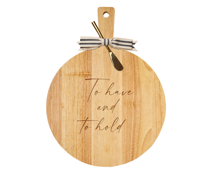 The Maple 19" x 14" Rubber Wood Thick Handle Board features "To Have And To Hold," a gold spreader, and a striped ribbon at the handle—making it a charming housewarming gift.
