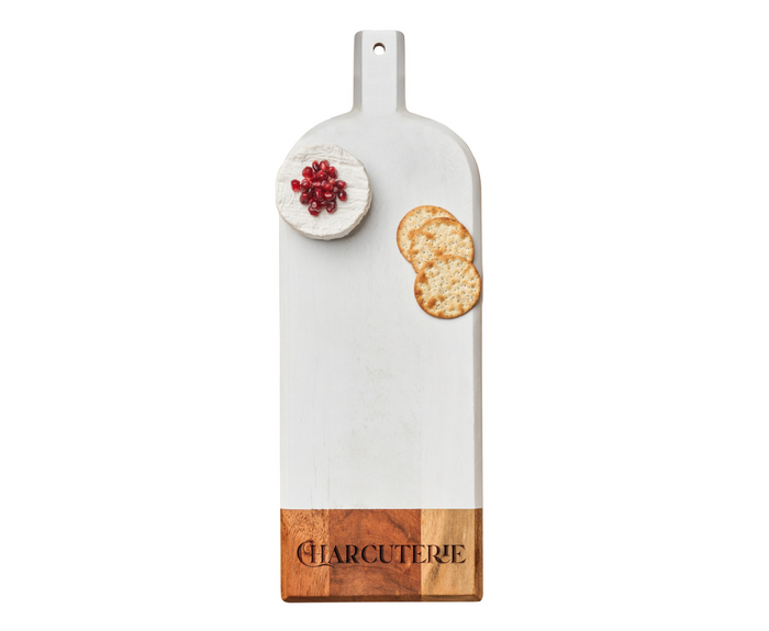 The Maple 20" x 7" Acacia Bevel Board in White | Charcuterie displays a round cheese topped with pomegranate seeds and two crackers on a crisp white background.