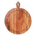 The Maple 20x16" Acacia Heirloom Board Round - Shana Tova Round features "Shana Tova" and its Hebrew equivalent elegantly engraved in a circle, making it a perfect Rosh Hashanah serving board with handle.