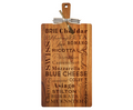 The Maple 24" x 12" Acacia Wood Thick Handle Board With Gold Spreader features engraved cheese names—Brie, Cheddar, Swiss, Feta, Mozzarella, and Gouda—and a bow tied around the handle, ideal for kitchen decor.