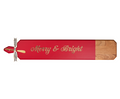 The Maple 34" x 6" Acacia Heirloom Board features a red section with “Merry & Bright” in gold script, a gold-tipped handle tied with a ribbon, and comes with a gold spreader.