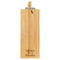 The Maple 35" x 12" Rubber Wood Thick Handle Cutting Board features "BITES ON A BOARD" engraved at the bottom and comes with an elegant metal cheese knife tied to the handle with a black and white ribbon.