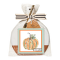The Sophistiplate 9.75" x 8" Board Gift Kit: Bright & Thankful includes an acacia wood charcuterie board, gold and white utensil, and pumpkin napkins, wrapped in clear plastic with a striped ribbon—perfect for serving appetizers.