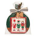 The Maple 9.75" x 8" Board Gift Kit: Nutcracker Christmas includes a festive card with three illustrated nutcrackers, gold stars, cinnamon sticks, ribbon, and tag—ideal to pair with Nutcracker Christmas cocktail napkins.