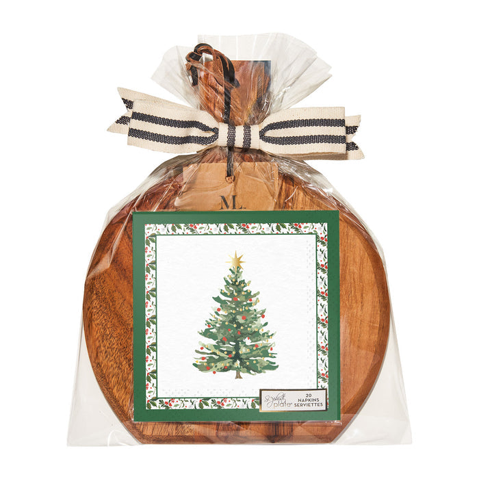 The Sophistiplate 9.75" x 8" Board Gift Kit: Home for the Holidays features a wooden charcuterie board with handle, clear plastic wrap, striped ribbon, and a festive napkin with a decorated Christmas tree and green holly border.