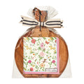 The Sophistiplate 9.75" x 8" Rococo Board Gift Kit features a round acacia wood board with a handle, packaged in clear plastic with a striped bow and includes floral-patterned cocktail napkins on the front. Spreader not included.