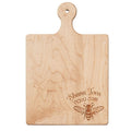 The Maple 9"x6" Maple Wood Board | Shana Tova is perfect as a cheese or charcuterie tray, featuring a handle and an engraved bee with “Shana Tova” in English and Hebrew in the bottom right corner.