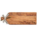 The Maple Acacia Bevel Board Long (20 x 7") features “Live • Love • Eat” engraving, a gold spreader, and a black-and-white striped ribbon—perfect for stylish and functional cheese or charcuterie presentations.