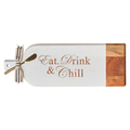 Maple's Acacia Bevel Board Long White (20 x 7") features "Eat, Drink & Chill" engraving, natural and white-painted sections, a striped ribbon on the handle, and comes with a gold spreader—perfect for stylish serving.