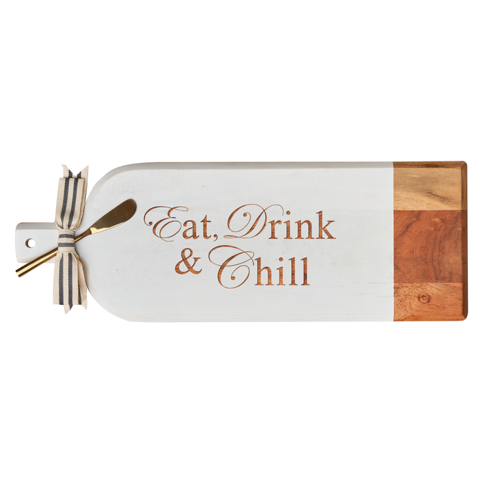 Maple's Acacia Bevel Board Long White (20 x 7") features "Eat, Drink & Chill" engraving, natural and white-painted sections, a striped ribbon on the handle, and comes with a gold spreader—perfect for stylish serving.