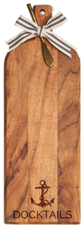 The Maple Acacia Bevel Board (20 x 7") features a striped ribbon-tied handle, gold spreader knife, and an engraved anchor above "DOCKTAILS," making this wood cheese board both stylish and special.