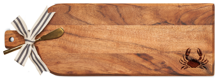 The Maple Acacia Bevel Board (20 x 7") features a striped ribbon on the handle with a gold spreader knife and an engraved crab accent, making it an elegant serving piece.