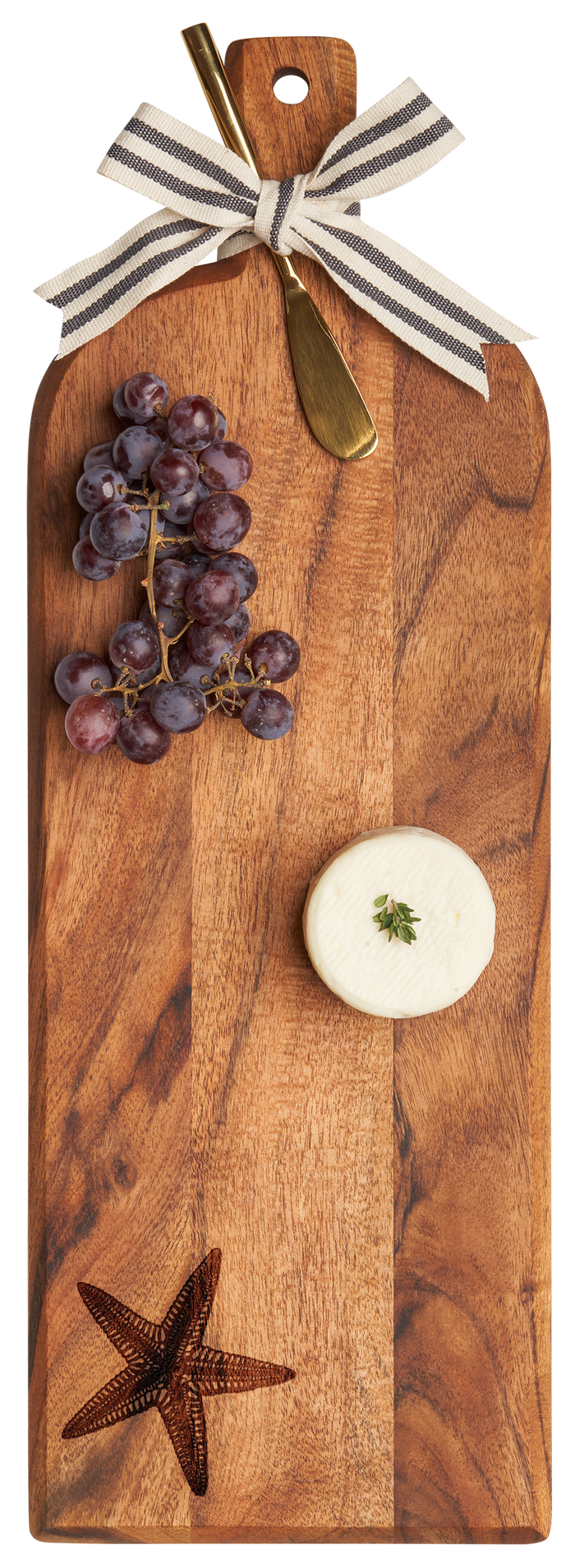 The Maple Acacia Bevel Board (20 x 7") with ribbon, starfish, and gold spreader knife is ideal for stylish entertaining—just add cheese and grapes for a chic charcuterie setup.