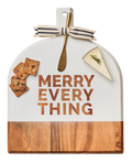 The Maple Acacia Bevel Board in white features "MERRY EVERYTHING," a gold spreader knife, and striped ribbon, sized 15" x 12" x .6"—perfect for serving cheese and crackers at festive gatherings.