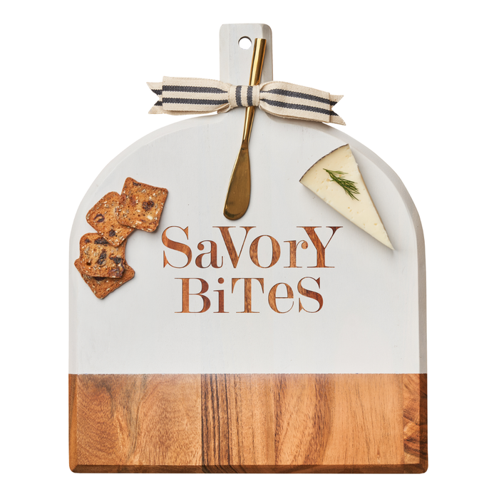 The Maple Acacia Bevel Board White (15"x12"x0.6") features "Savory Bites" engraving, a striped ribbon, gold spreader knife, three crackers, and dill-garnished cheese—perfect for stylish serving.