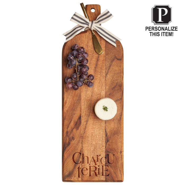 The Maple Acacia Bevel Board with Long Handle (20 x 7") features "Charcuterie" engraved at the bottom and can be personalized with a monogram or added to a gift set—perfect for serving grapes, cheese, and charcuterie.