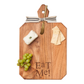 The Maple Acacia Heirloom Board Rectangle (16x10") features "Eat Me" engraving, a gold spreader, striped ribbon, plus cheese, crackers, and green grapes for a charming serving set.