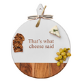 The Maple Acacia Heirloom Board, 20"x16", features a round white design with "That's What Cheese Said," a gold ribbon-tied spreader, and is perfect for serving cheese, crackers, and grapes.