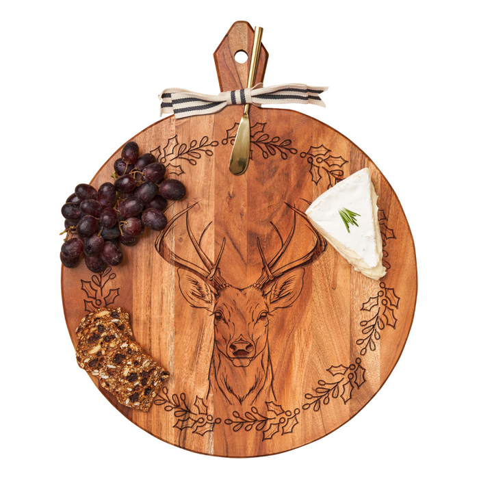 The Maple Acacia Heirloom Board Round with Stag design (20 x 16”) features cheese, grapes, seeded crackers, and comes with a gold spreader and striped ribbon—ideal for adding a personalized monogram.