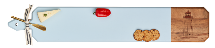 The Maple Acacia Heirloom Board w/ Handle Skinny in Light Blue (34 x 6") features a lighthouse engraving and is displayed with cheese, a red grape tomato, three crackers, and a ribbon-tied cheese knife.
