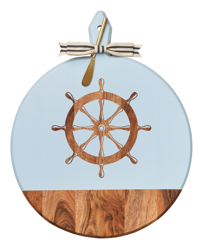 The Maple Acacia Heirloom Board with Handle (20 x 16"), featuring a ship’s wheel design, woodgrain base, gray & white ribbon, and gold spreader, is perfect for serving charcuterie.