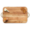 The Maple Acacia Wood Cutting + Cheeseboard w/ Gold Handles (18 x 12”) displays a wedge of herbed cheese, crispbread, and a meat, cheese, and veggie skewer—all artfully arranged on its elegant surface.