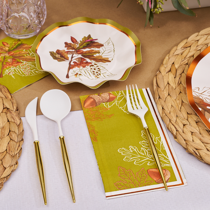 Create a festive autumn table with Sophistiplate’s Acorn and Oak Appetizer/Dessert Bowls (8pk), featuring gold-accented designs of leaves and acorns from the Acorn and Oak Collection. Pair these elegant disposable scalloped bowls with fall-themed plates, gold and white cutlery, green leaf-patterned napkins, woven placemats, and a white-and-brown tablecloth for a stunning Thanksgiving tablescape.