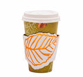 The Sophistiplate Acorn and Oak Paper To-Go-Cup (8pk) features a white lid, an autumn sleeve with an orange leaf, and a green background with fall motifs like leaves and acorns—perfect for autumn lovers on the go.