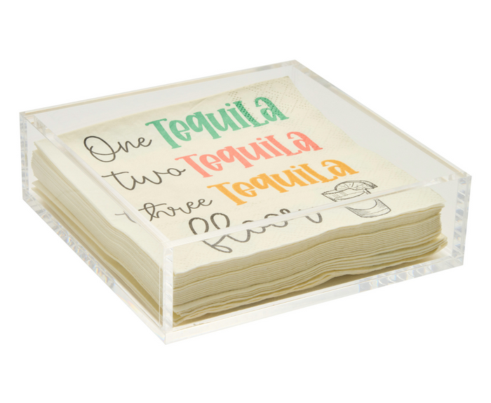 A stack of colorful cocktail napkins sits in a Sophistiplate Acrylic Cocktail Napkin Tray - Clear. The top napkin reads: One Tequila, two Tequila, three Tequila, each word in a different color with a sketch of a tequila shot glass.