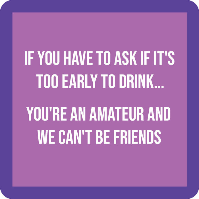 The Drinks On Me Amateur Coaster features a purple border, light purple background, and bold white text: "If you have to ask if it's too early to drink... you're an amateur and we can't be friends." A fun gift or quirky bar cart accessory!.