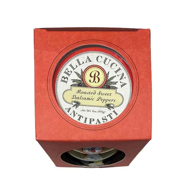 A red Antipasti Gift Box by Bella Cucina, featuring Roasted Sweet Balsamic Peppers with a decorative round label—ideal as antipasti condiments or a delicious cheese board addition.