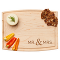 The Arched Artisan Maple Board | Modern Mr. & Mrs. by Maple (12 x 9") holds a round cheese with rosemary, three fruit and nut crisps, and sliced red and yellow mini bell peppers.