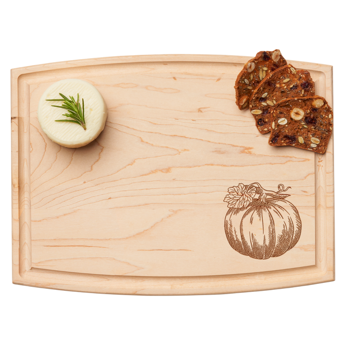 The Maple Arched Artisan Maple Board | Pumpkin | 12 x 9" features a round cheese wheel with rosemary, fruit and nut crackers, and a pumpkin illustration in the bottom right corner.