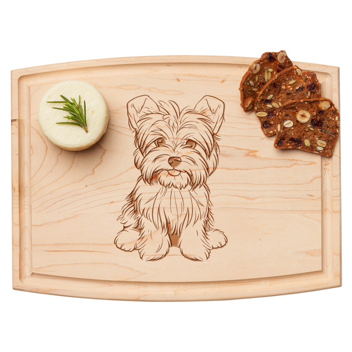 The Maple Arched Artisan Maple Board (12 x 9") features a Yorkshire Terrier engraving, with space for cheese and bread—ideal as a charming serving board.
