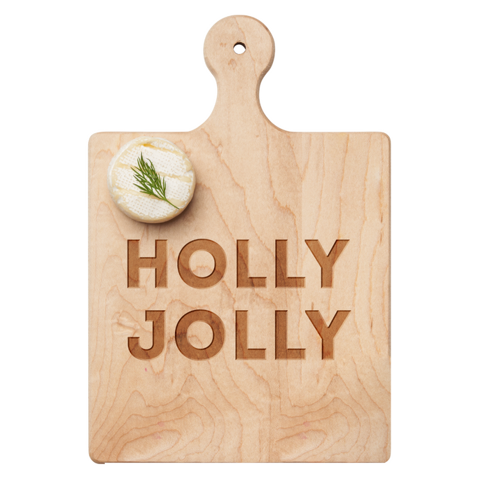 The Maple Artisan Maple Paddle Board | Holly Jolly | 9 x 6" features “HOLLY JOLLY” engraving and is ideal for serving cheese, like one topped with dill—perfect for your next charcuterie board spread.