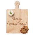 The Maple Artisan Maple Paddle Board | Merry Everything | 9" x 6" holds a dill-topped macaron and a fruit and nut crisp—an ideal addition to any cheese board or charcuterie spread.