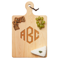 The Maple Artisan Maple Paddle Board | Personalized | 16 x 10" displays green grapes, crackers, and herb-garnished brie. This board, from brand Maple, features custom engraving and a handy leather loop for easy handling.