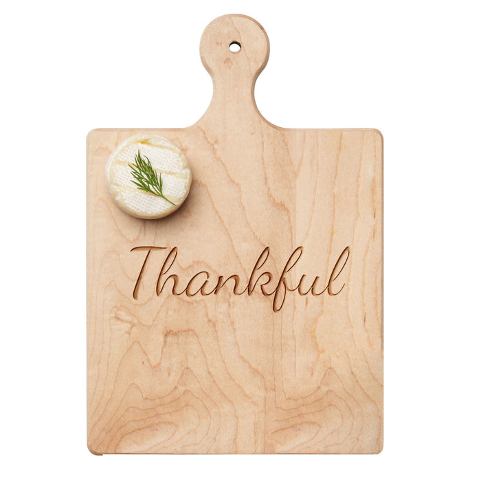 The Maple Artisan Maple Paddle Board | Thankful | 9 x 6" features a cursive "Thankful" engraving and is perfect as a stylish charcuterie board for gatherings.
