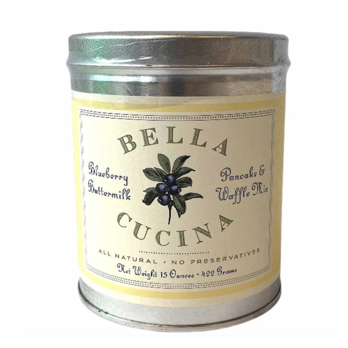 A silver tin from Bella Cucina holds Blueberry Buttermilk Pancake & Waffle Mix, all-natural with no preservatives. The 15 oz (429 g) tin features a blueberry illustration on the label.