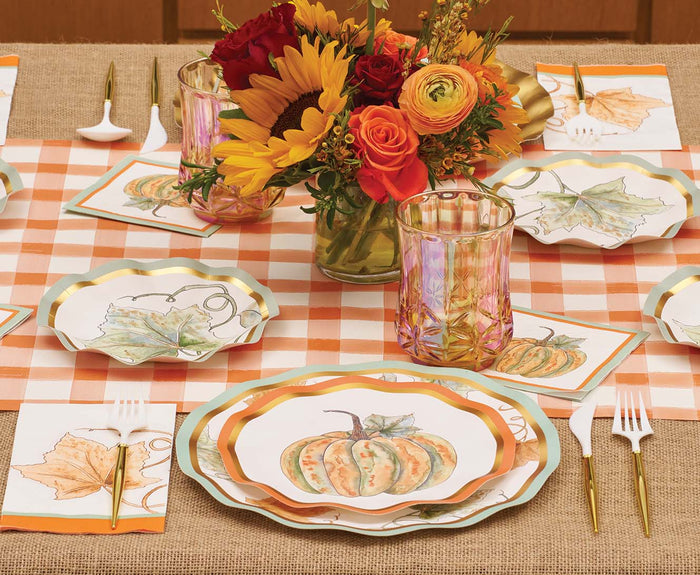 Elevate your fall table setting with pumpkin and leaf-patterned plates, gold cutlery, an orange plaid runner, elegant glassware, and a sunflower-and-rose centerpiece in a jar—perfectly complemented by the Sophistiplate Bright & Thankful Appetizer/Dessert Bowls (8pk), whose scalloped edges add an elegant seasonal touch to your gathering.