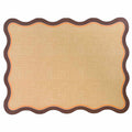 The Rosanne Beck Brown & Orange Scallop Edge Placemats/10pk feature a wavy dark brown border with orange trim, resembling classic placemats. Set against a white background, their blank textured surface is perfect for displaying notes or decor.