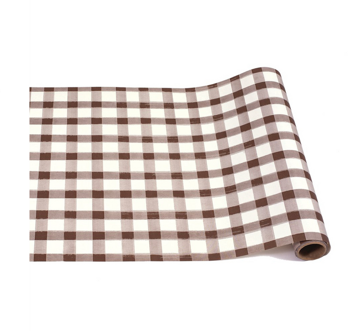 The Hester & Cook Brown Painted Check Runner (20x25") features a stylish brown and white grid pattern, ideal for creative table settings or gift wrapping.