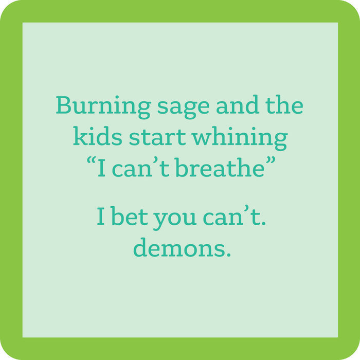 The Burning Sage Coaster by Drinks On Me features a green border, pale blue center, and the funny quote: "Burning sage and the kids start whining I can’t breathe. I bet you can’t. demons." A quirky drink coaster and housewarming gift.