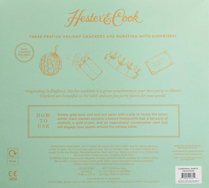 Peppermint Stripe Crackers by Hester & Cook come in festive green packaging with gold details. Each cracker includes a honeycomb ball, confetti, toy, hat, and conversation card—ideal as holiday table décor or party favors.