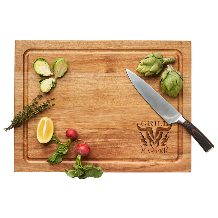 A Maple Carv'd Acacia Carving Board (15x20") engraved with GRILL MASTER 710 holds Brussels sprouts, artichoke, thyme, lemon wedge, radishes, and includes a 13" German steel chef's knife.
