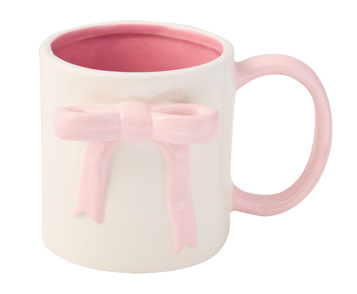 The Sophistiplate Ceramic Pink Bow Side Mug, 16oz, features a white exterior, pink interior and handle, plus a raised pink bow. Both microwave and dishwasher safe for everyday convenience.
