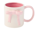 The Sophistiplate Ceramic Pink Bow Side Mug, 16oz, features a white exterior, pink interior and handle, plus a raised pink bow. Both microwave and dishwasher safe for everyday convenience.