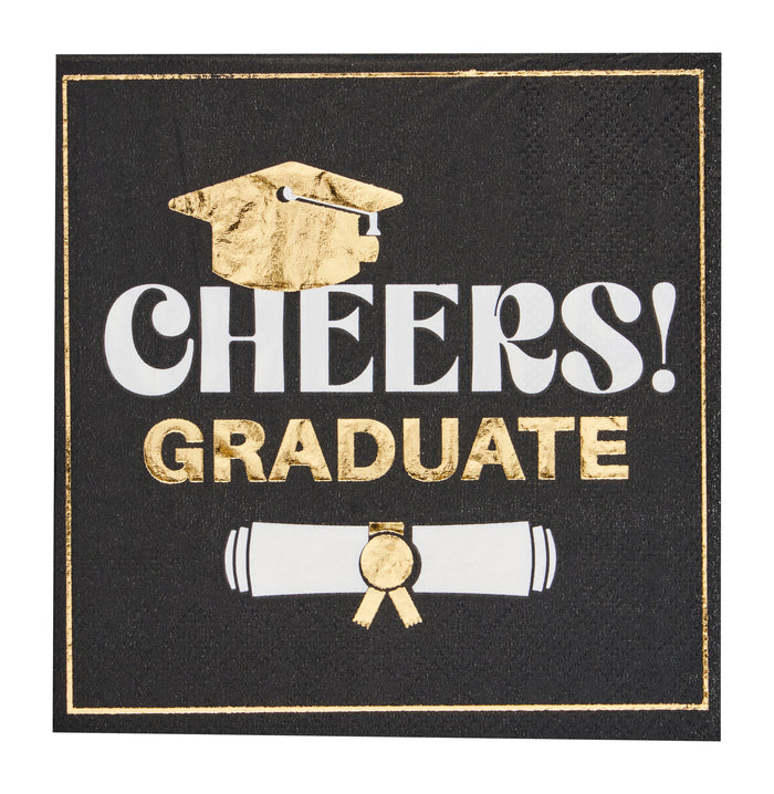 The Sugarplum Cheers Graduate Cocktail Napkins (26pk) feature a black square design with gold and white "CHEERS! GRADUATE" text, a gold cap above, and a rolled diploma tied with a gold ribbon—perfect for graduation celebrations.